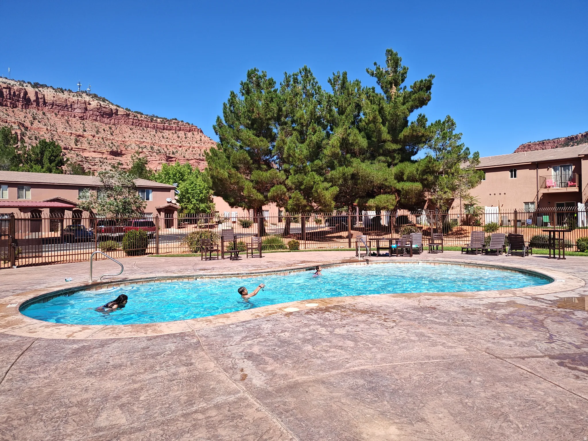 Community pool featuring a patio area and a mountain view