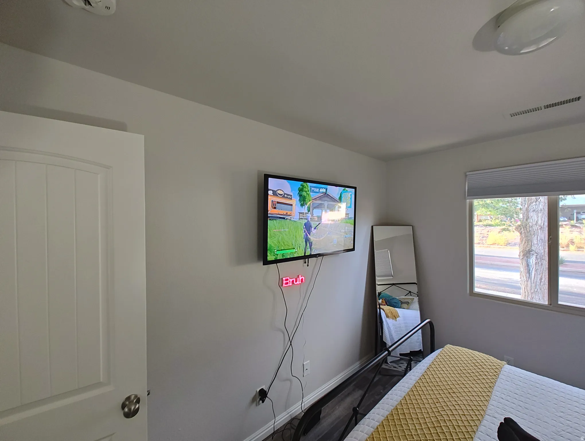 Bedroom featuring wood finished floors and baseboards