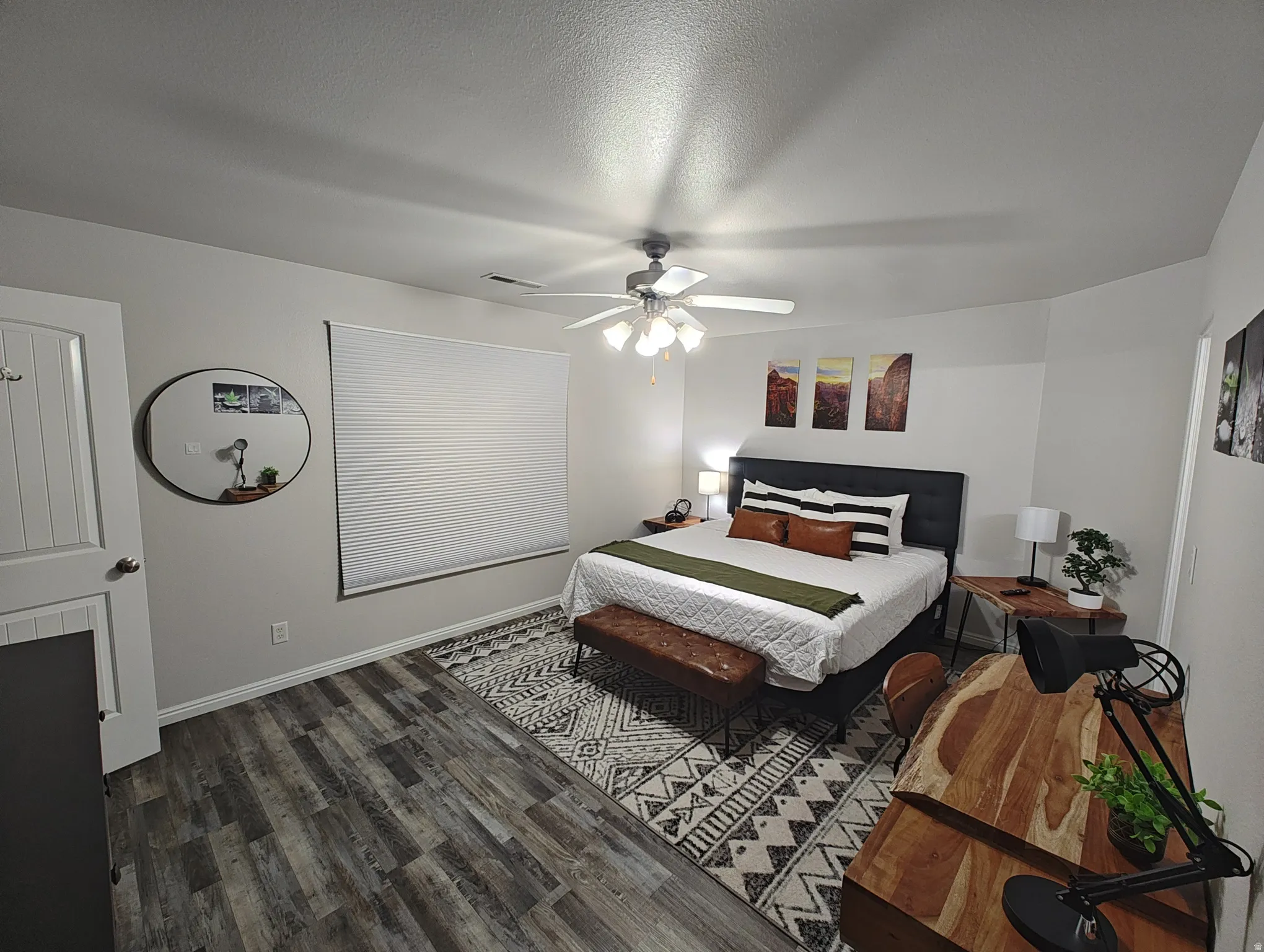 Master Bedroom featuring dark wood-type flooring, a ceiling fan, and a textured ceiling