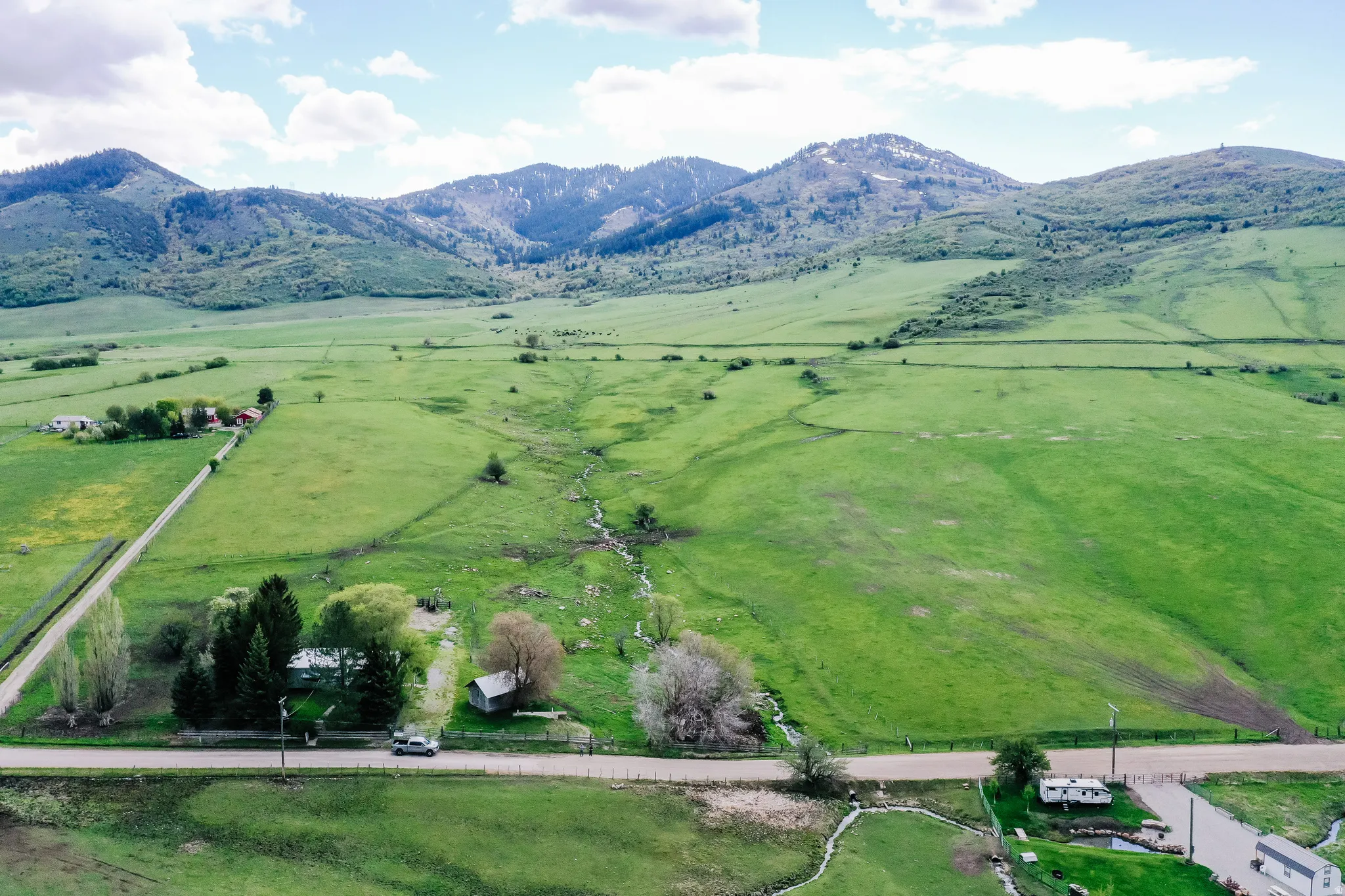 View of rural area featuring a pastoral area and a mountain backdrop