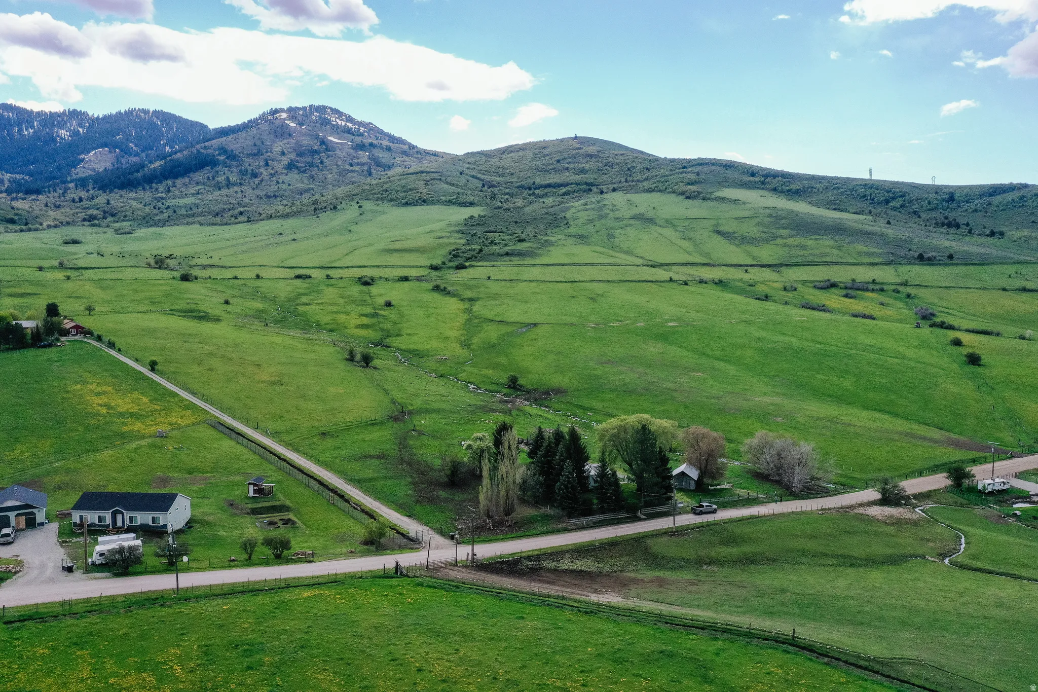 View of rural area with a pastoral area and mountains