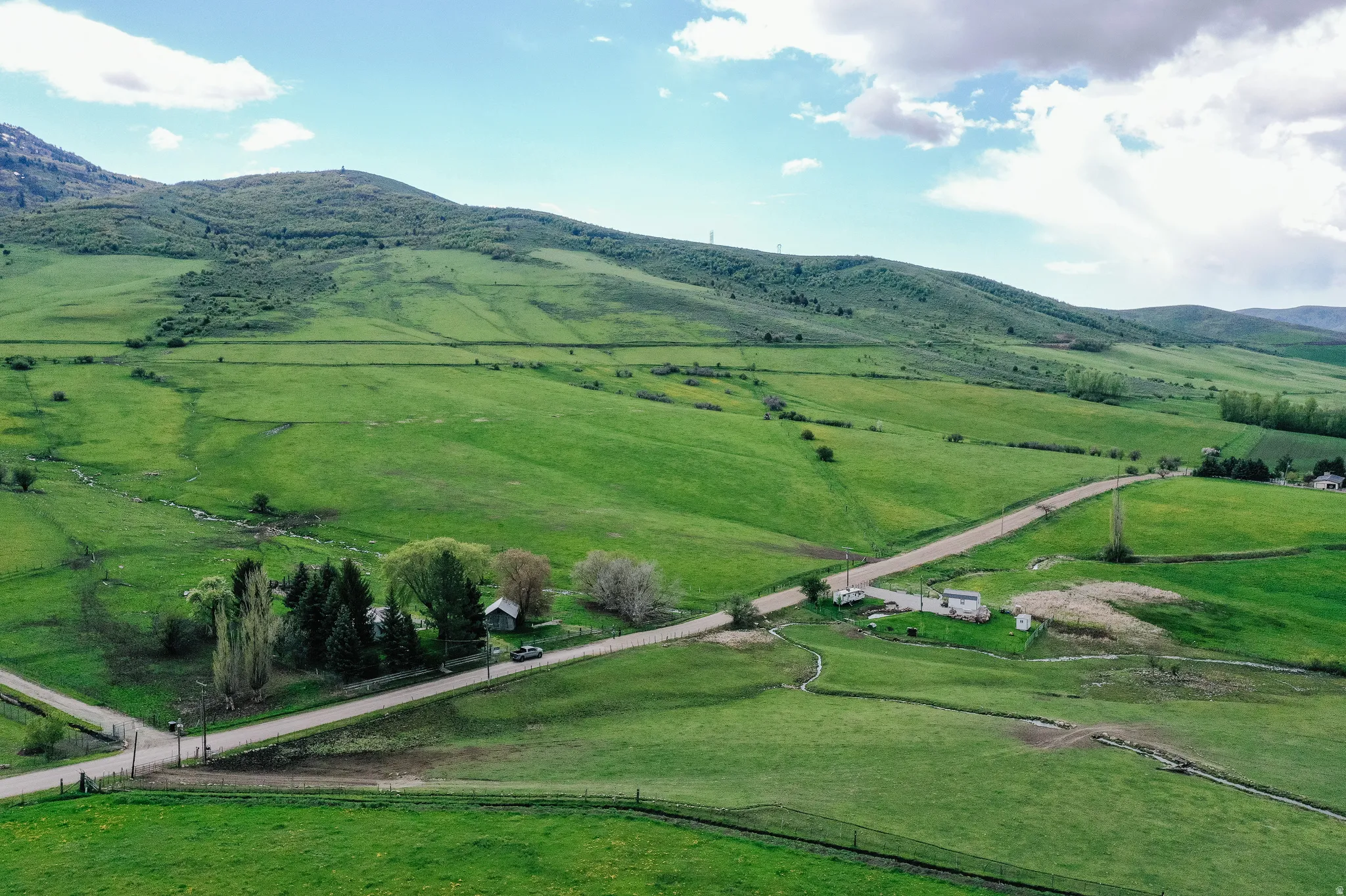 View of mountain background featuring rural landscape and agricultural land