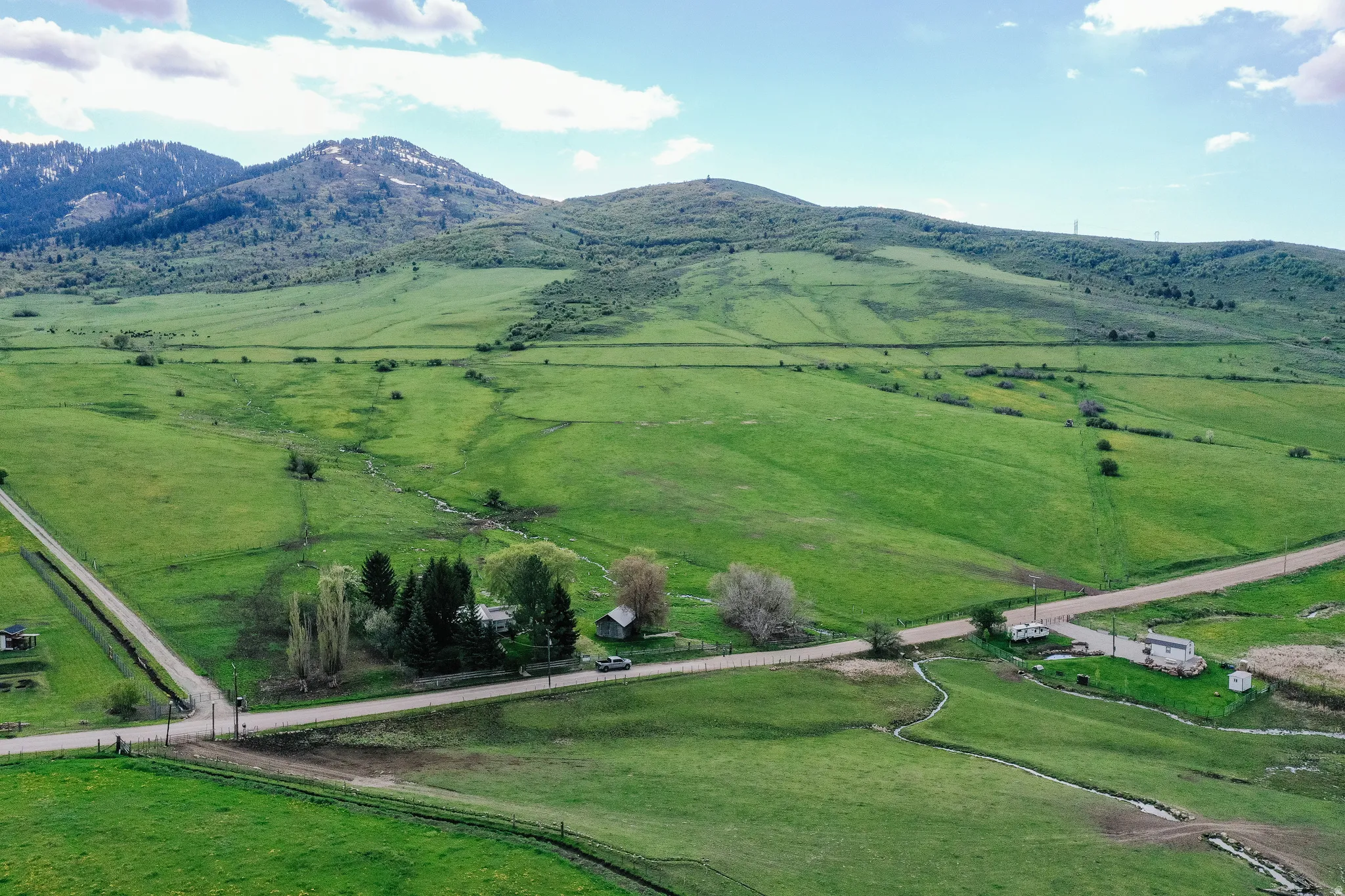 View of rural area featuring agricultural land and mountains