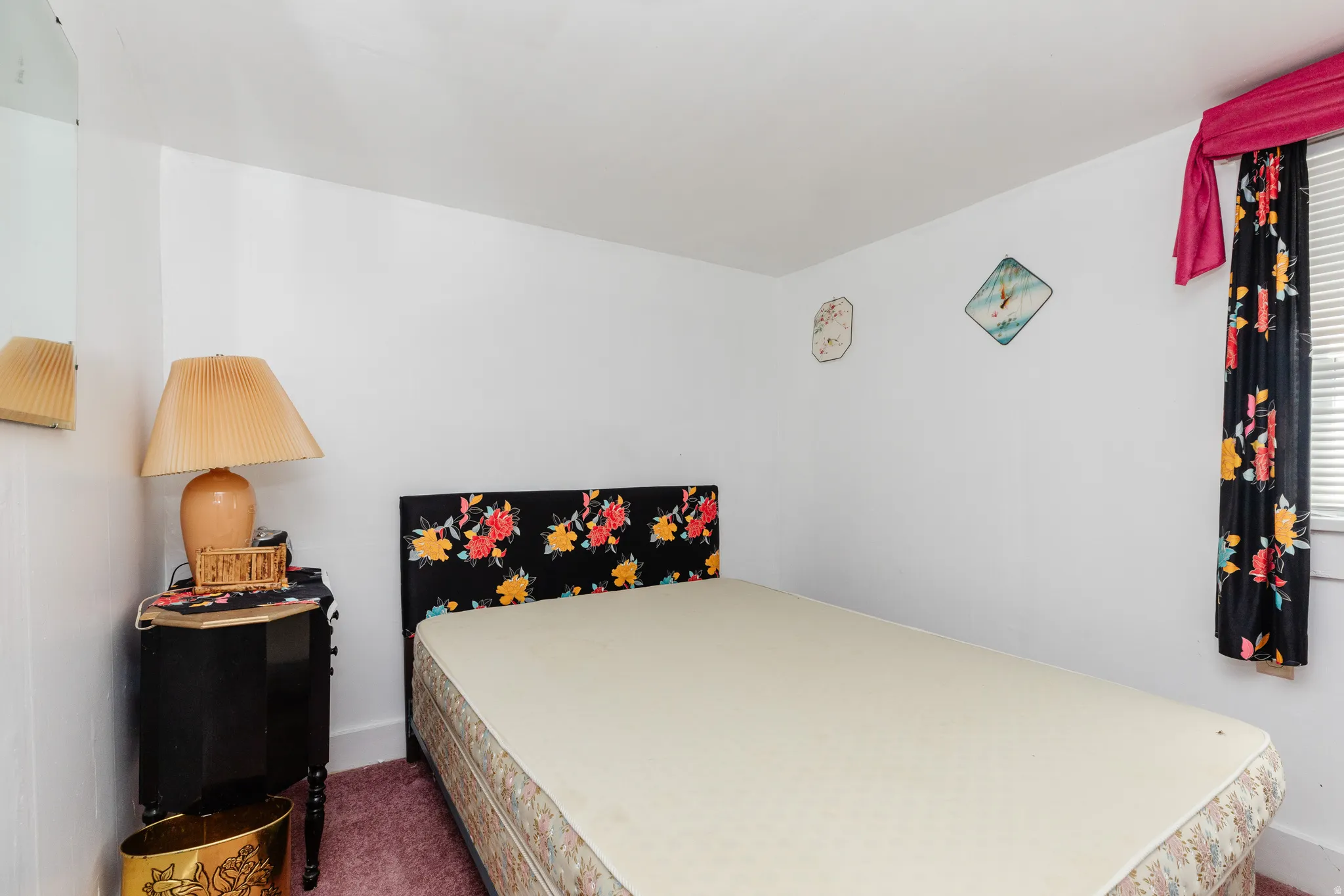 Bedroom featuring dark carpet