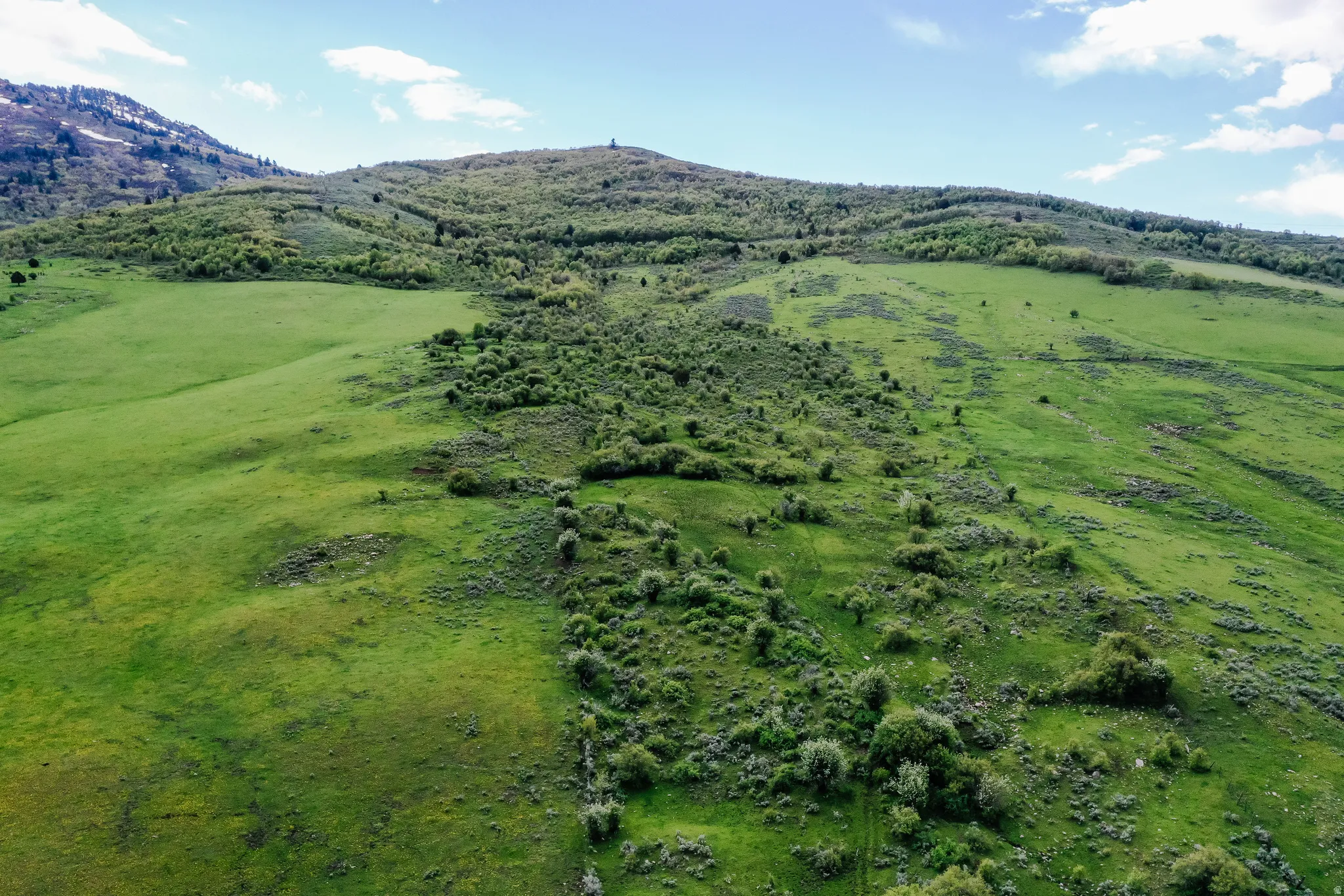 Drone / aerial view of a mountainous background