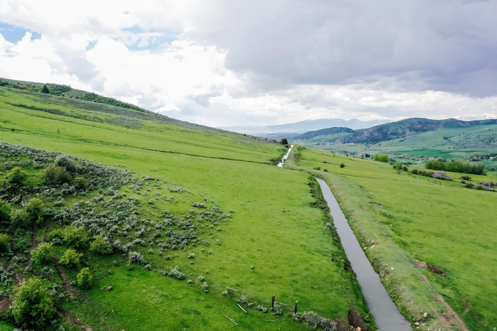 Overview of rural landscape featuring agricultural land and mountains