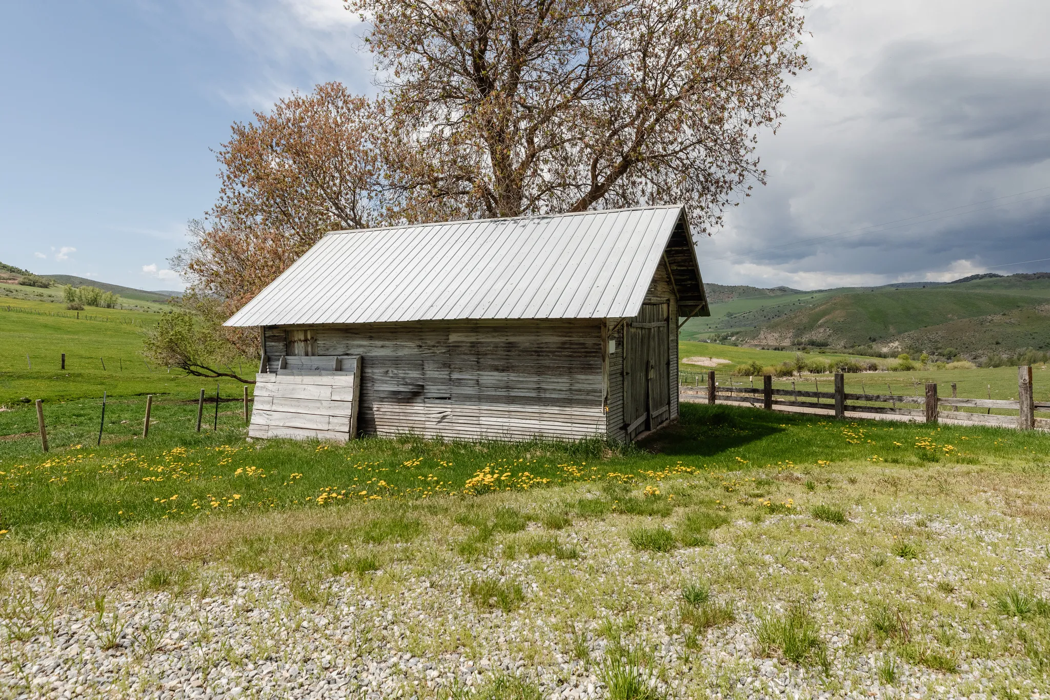 View of outbuilding with a rural view and a mountain view