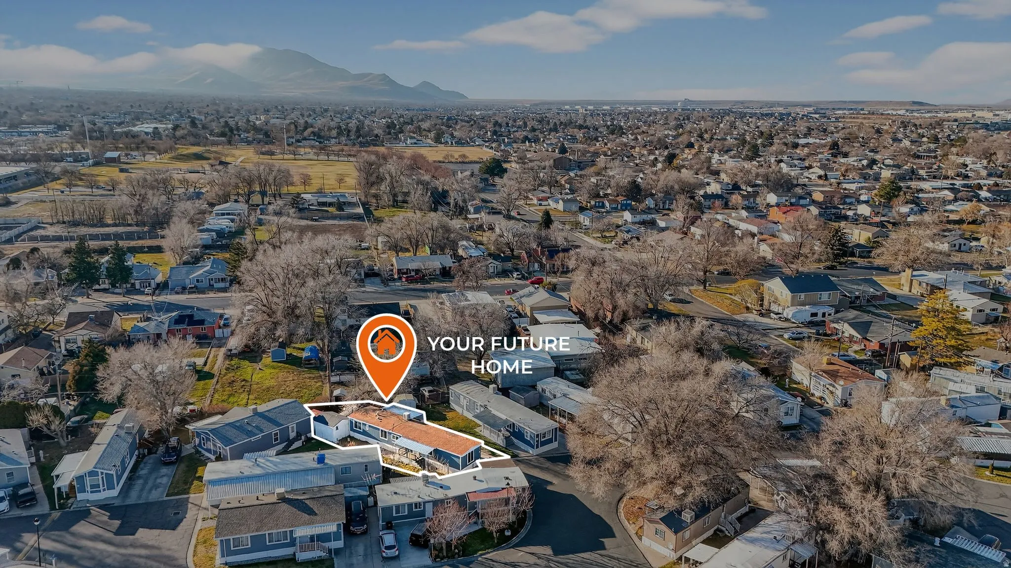 Aerial view of residential area with a mountain backdrop