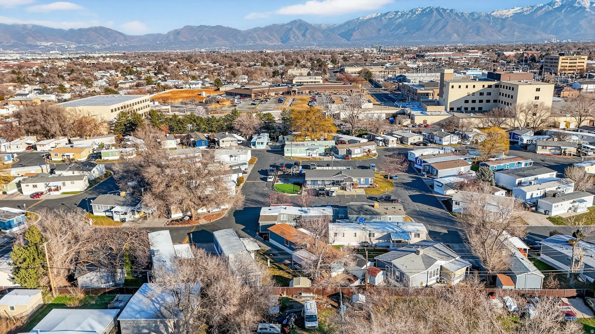 Aerial perspective of suburban area featuring a mountain backdrop