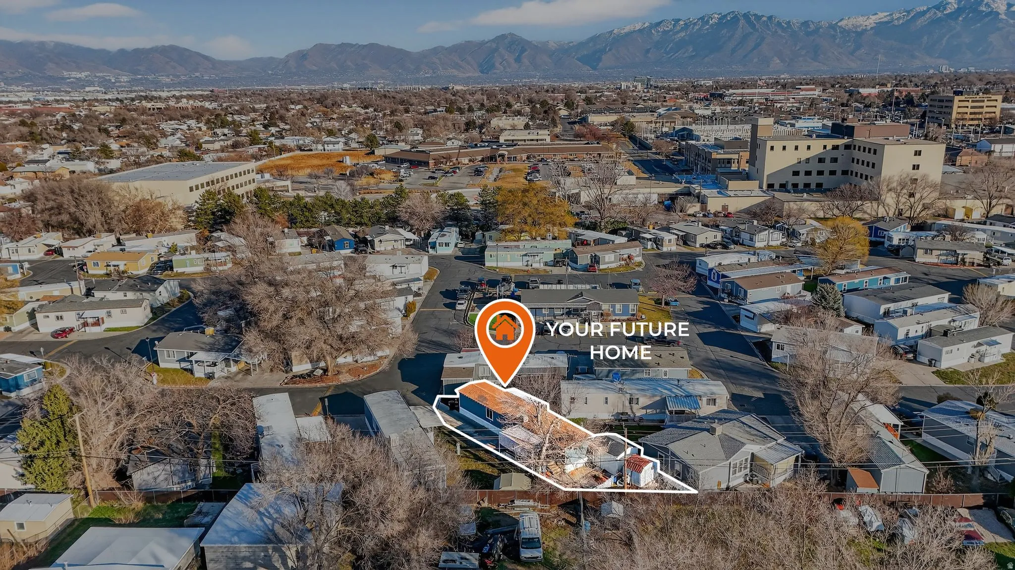 Aerial perspective of suburban area featuring a mountain backdrop