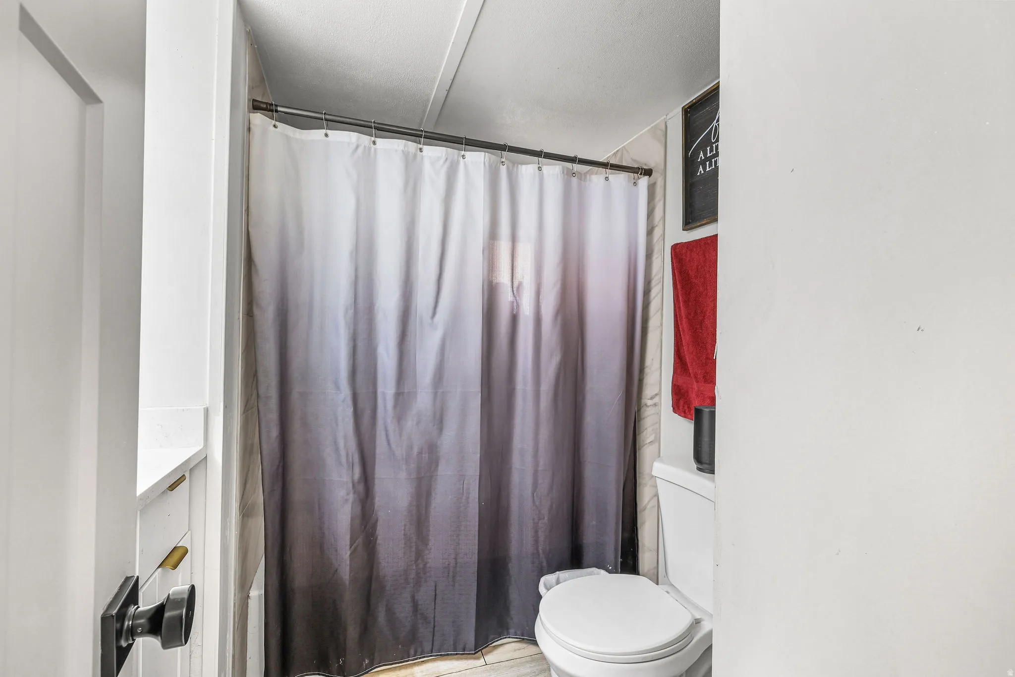 Full bath with shower / tub combo and toilet