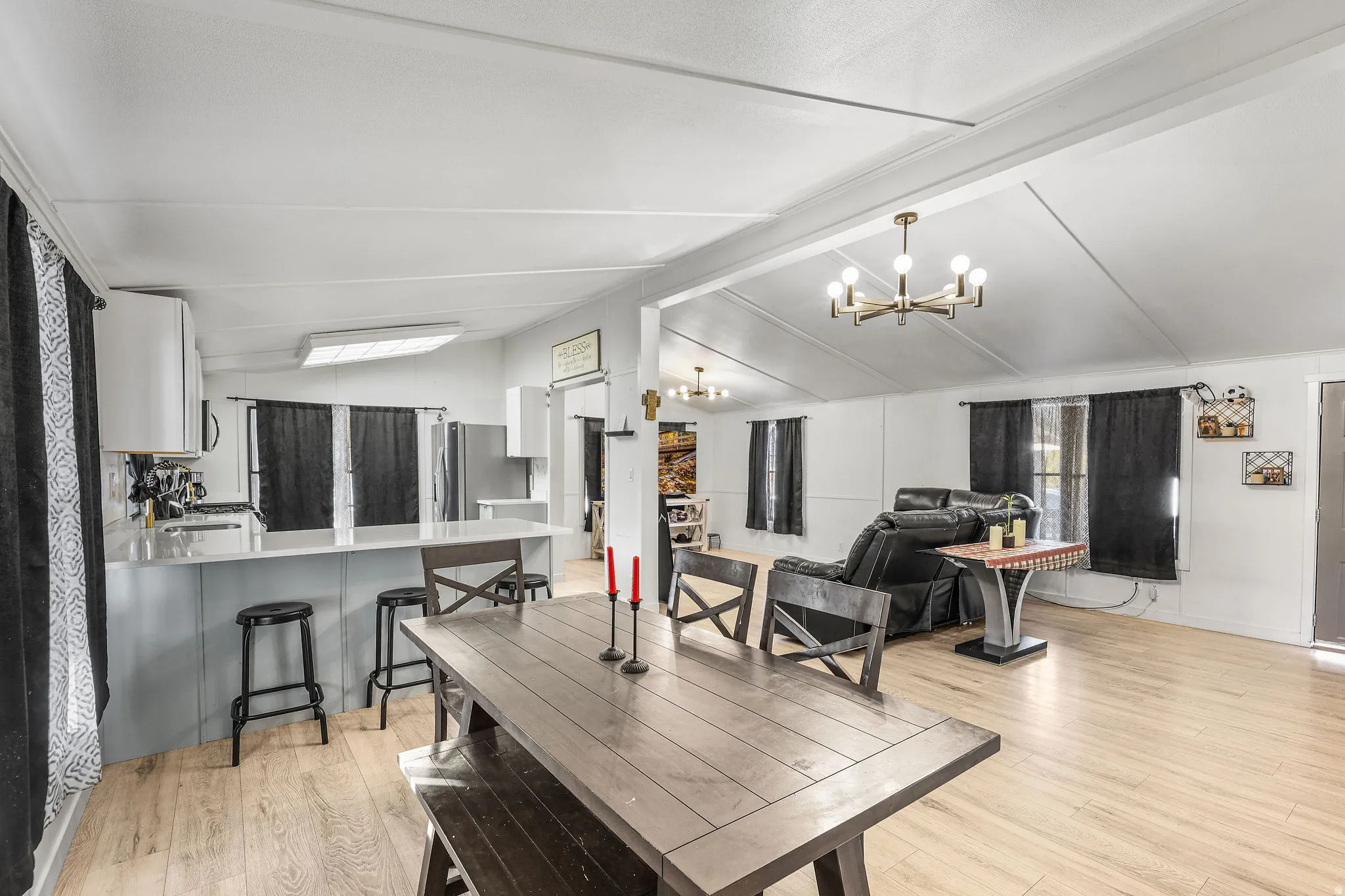 Dining space featuring light wood-style floors and a chandelier