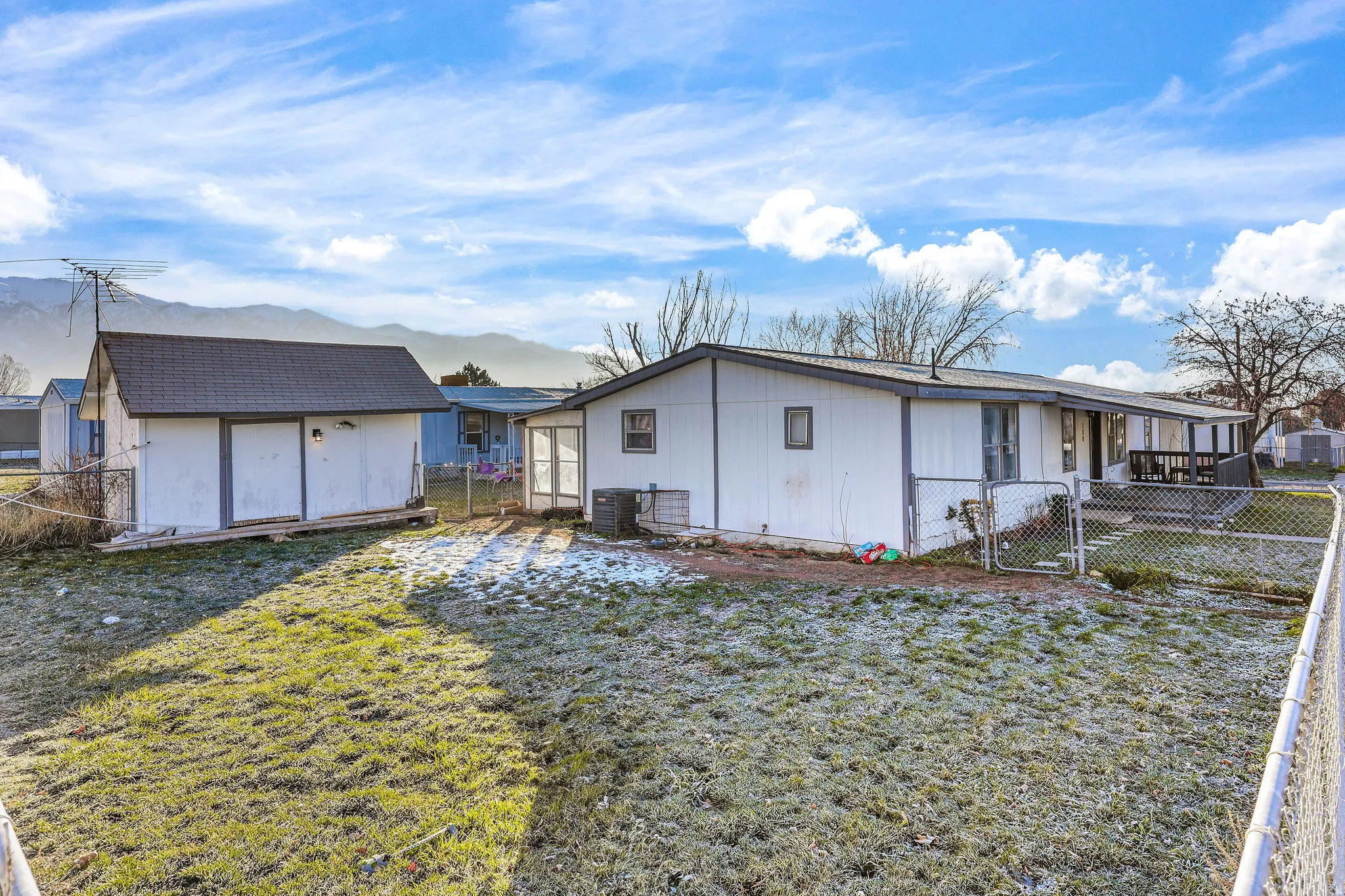 Rear view of property featuring a gate and a deck with mountain view