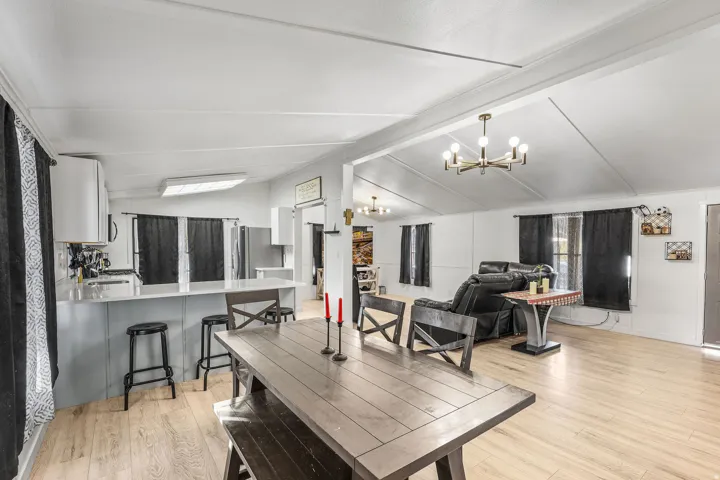 Dining space featuring light wood-style floors and a chandelier