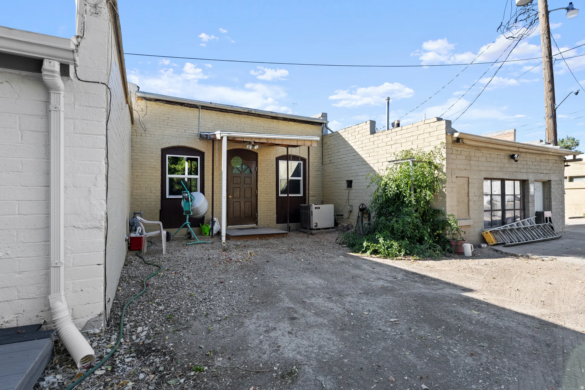 Back of property with brick siding