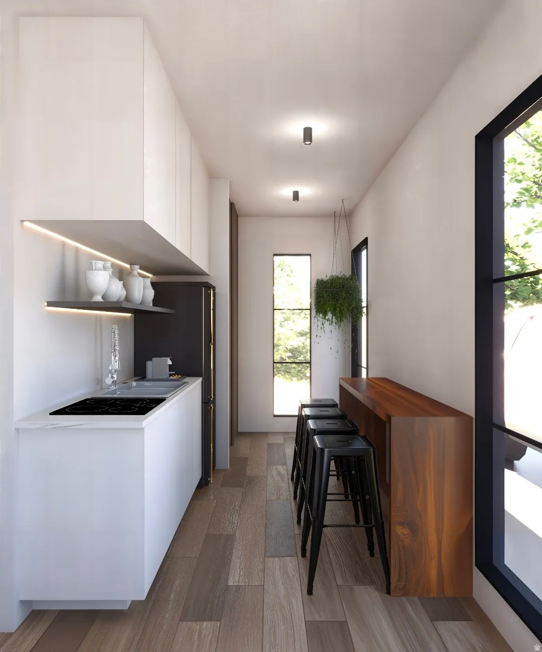 Kitchen with modern cabinets, white cabinetry, freestanding refrigerator, and black electric stovetop