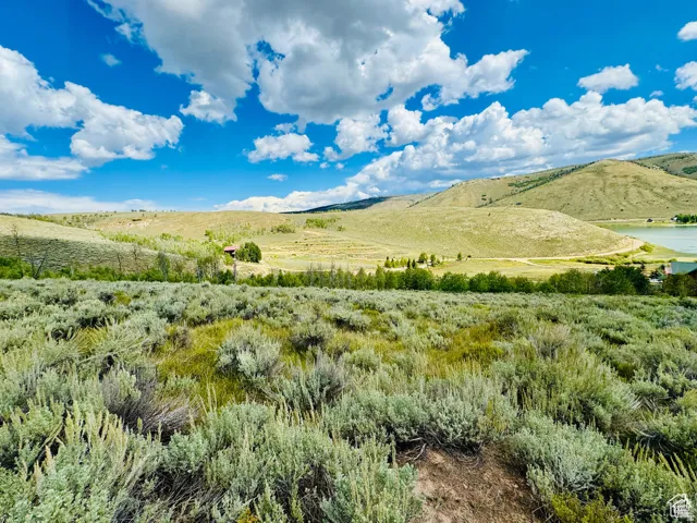 View of mountain backdrop featuring rural landscape