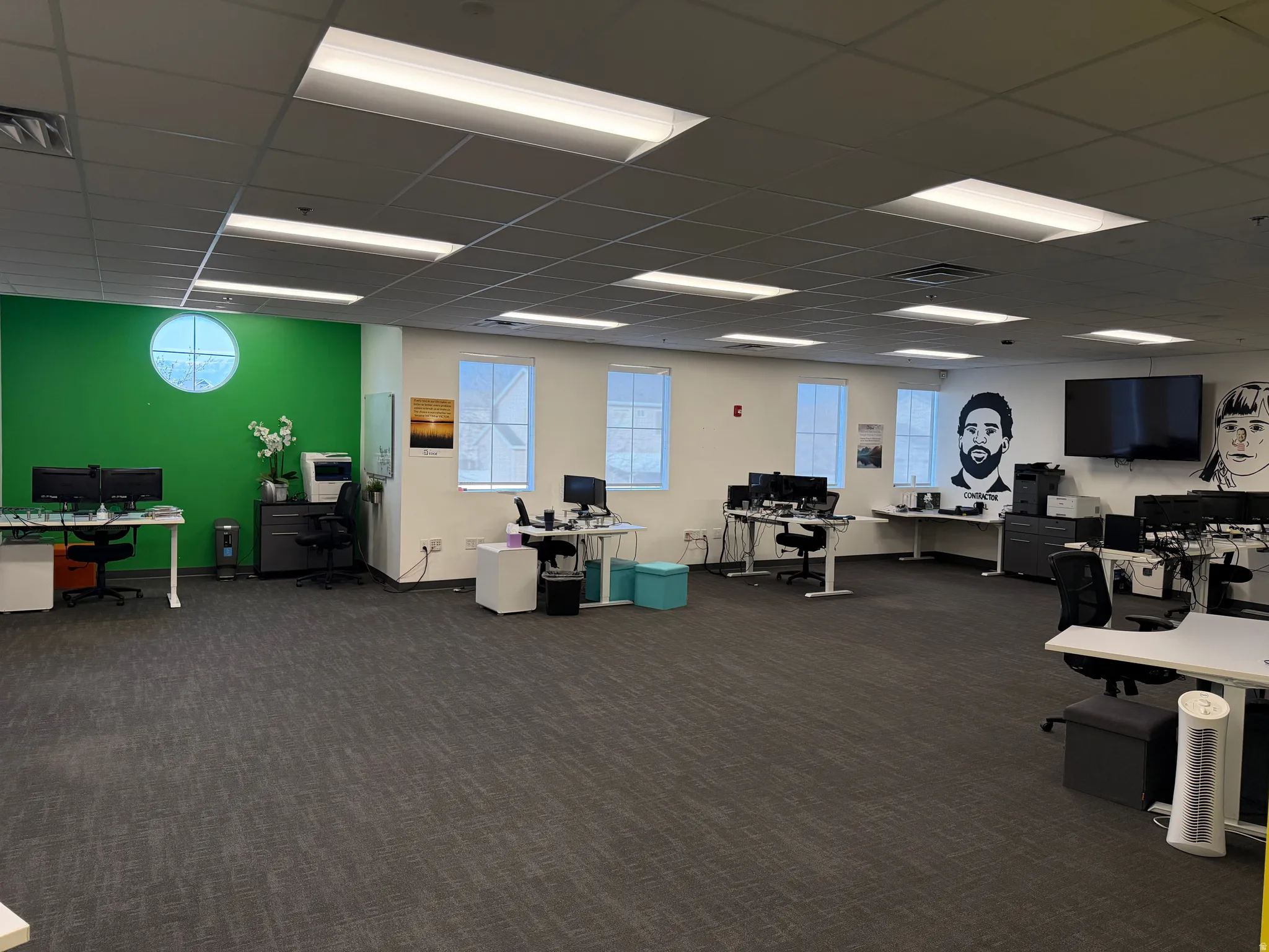 Office featuring plenty of natural light and a paneled ceiling