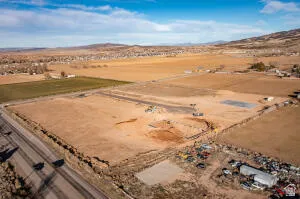 Aerial view of property's location with rural landscape and a mountain backdrop