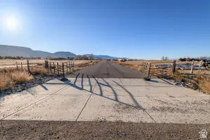 View of road featuring a view of rural / pastoral area and a mountain view
