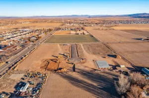 Aerial overview of property's location with rural landscape and mountains
