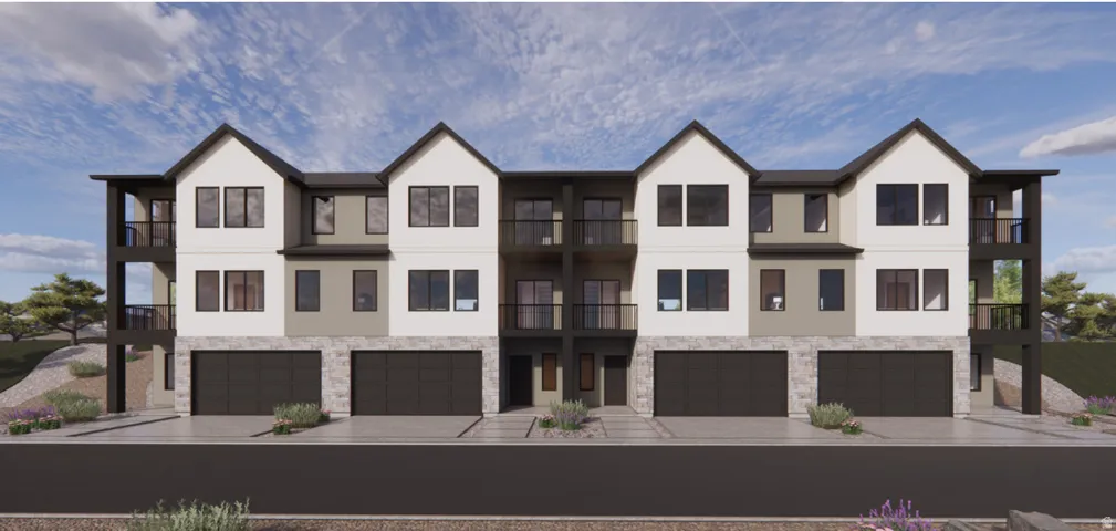 View of front facade featuring stone siding, stucco siding, driveway, and an attached garage