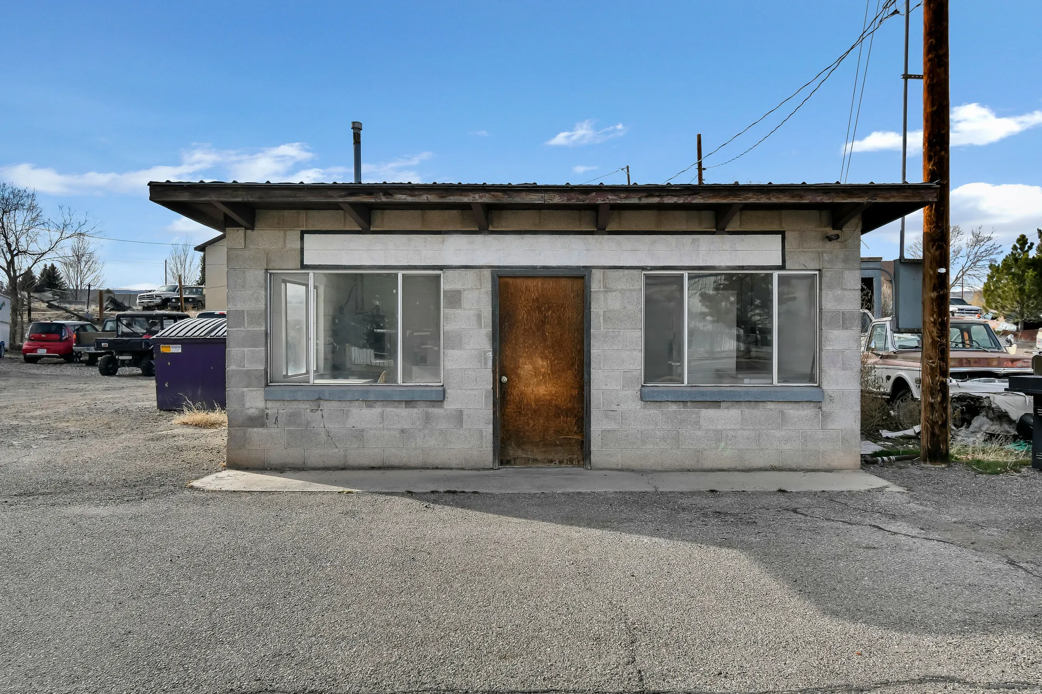 View of front of property with concrete block siding