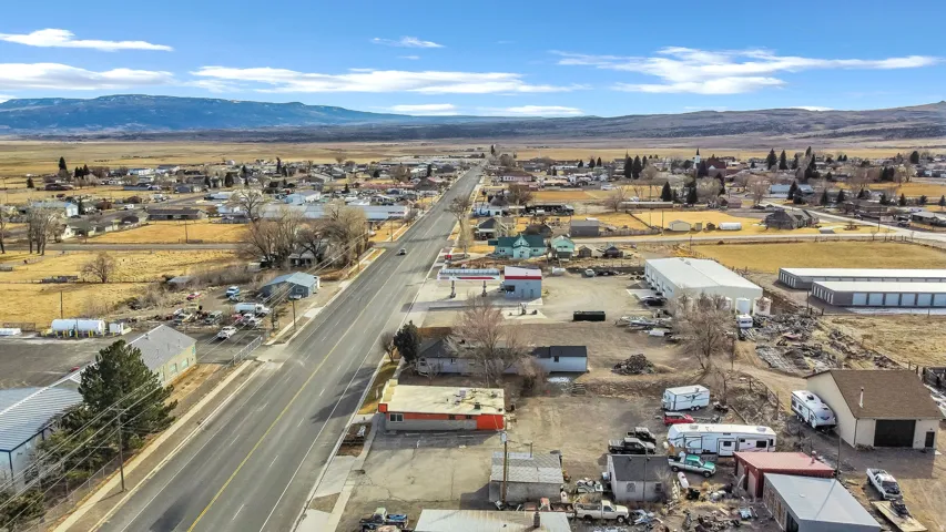 Aerial view of a mountain backdrop and industrial structures