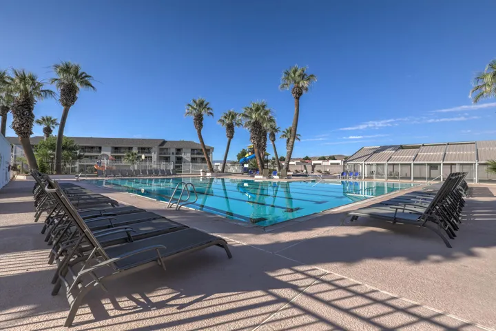 Community pool with a patio area