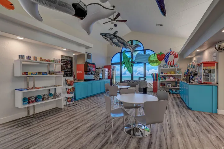Dining space featuring vaulted ceiling, light wood-style floors, ceiling fan, and recessed lighting