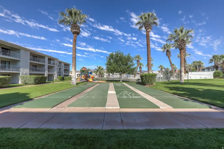 View of home's community with shuffleboard