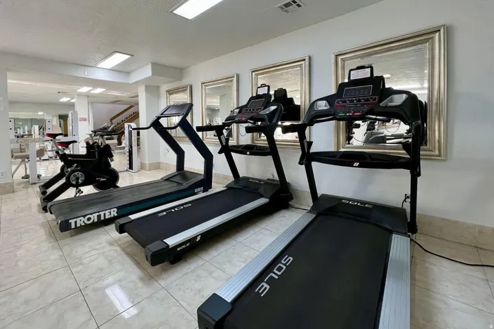 Exercise room with a textured ceiling