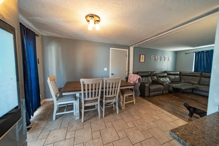 Dining area featuring a textured ceiling