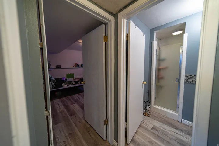 Corridor with light wood-type flooring