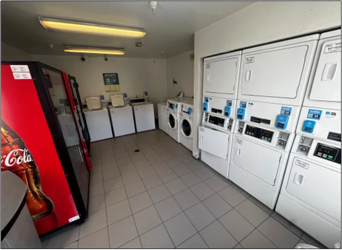 Community laundry with washing machine and dryer and estacked washer and dryer