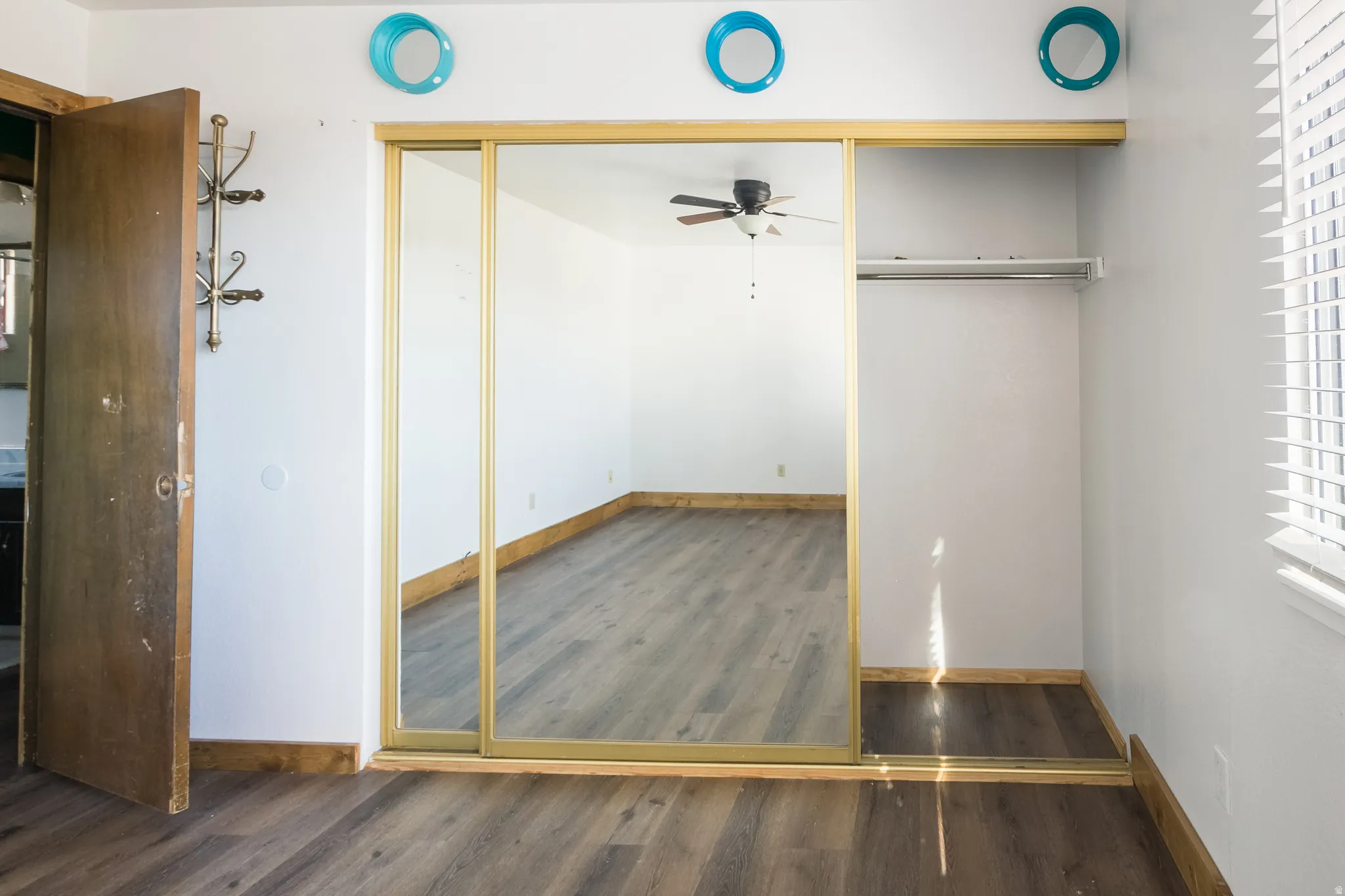 Unfurnished bedroom featuring dark wood finished floors