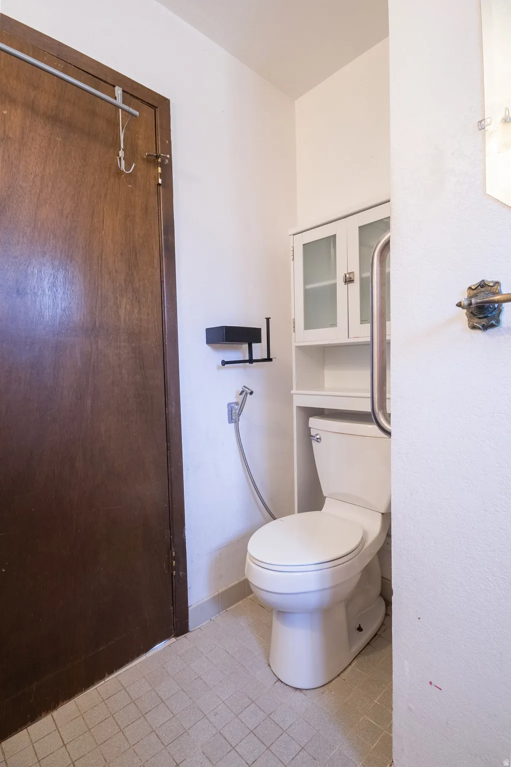 Bathroom featuring toilet and baseboards