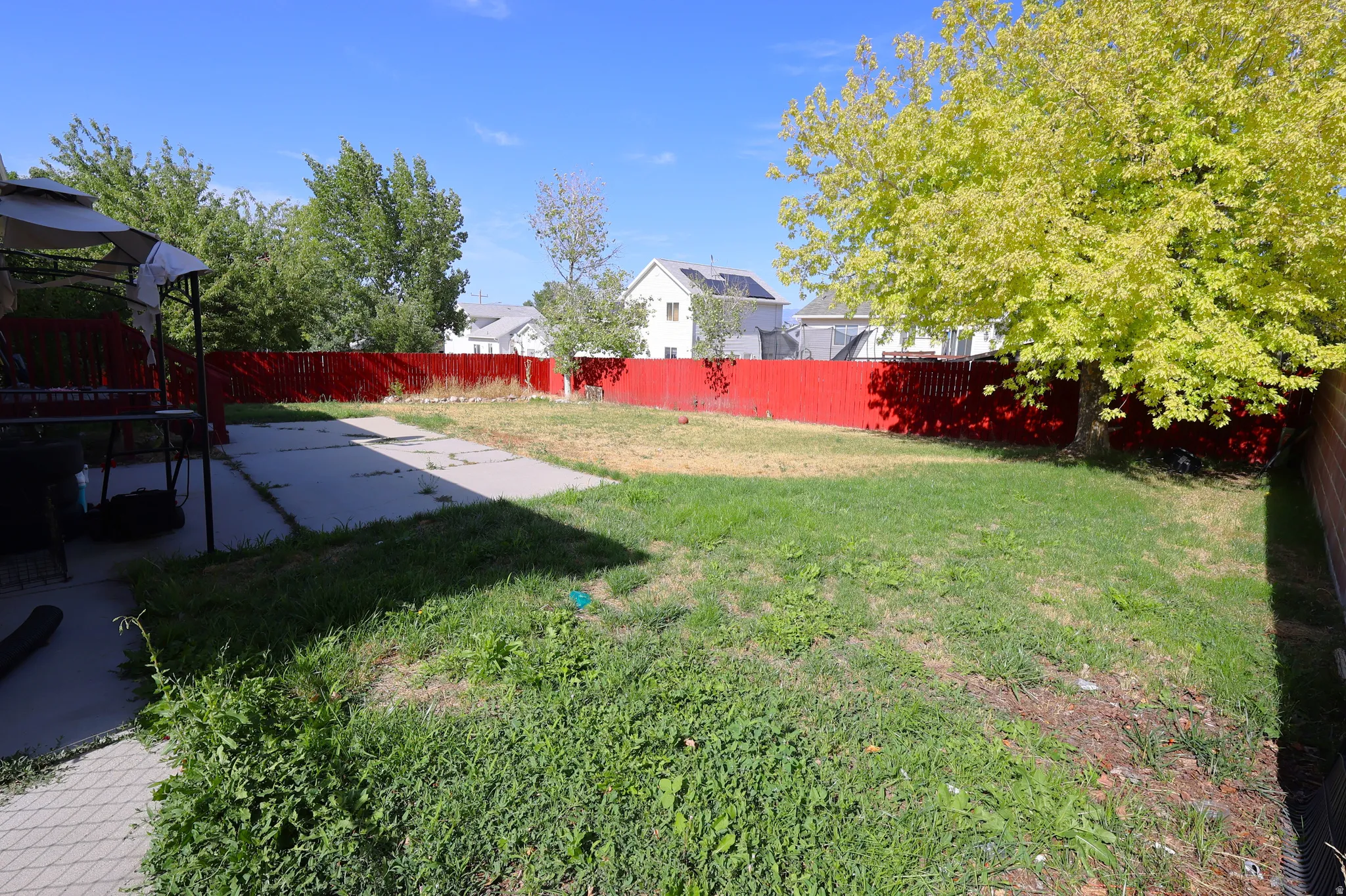 View of fenced backyard