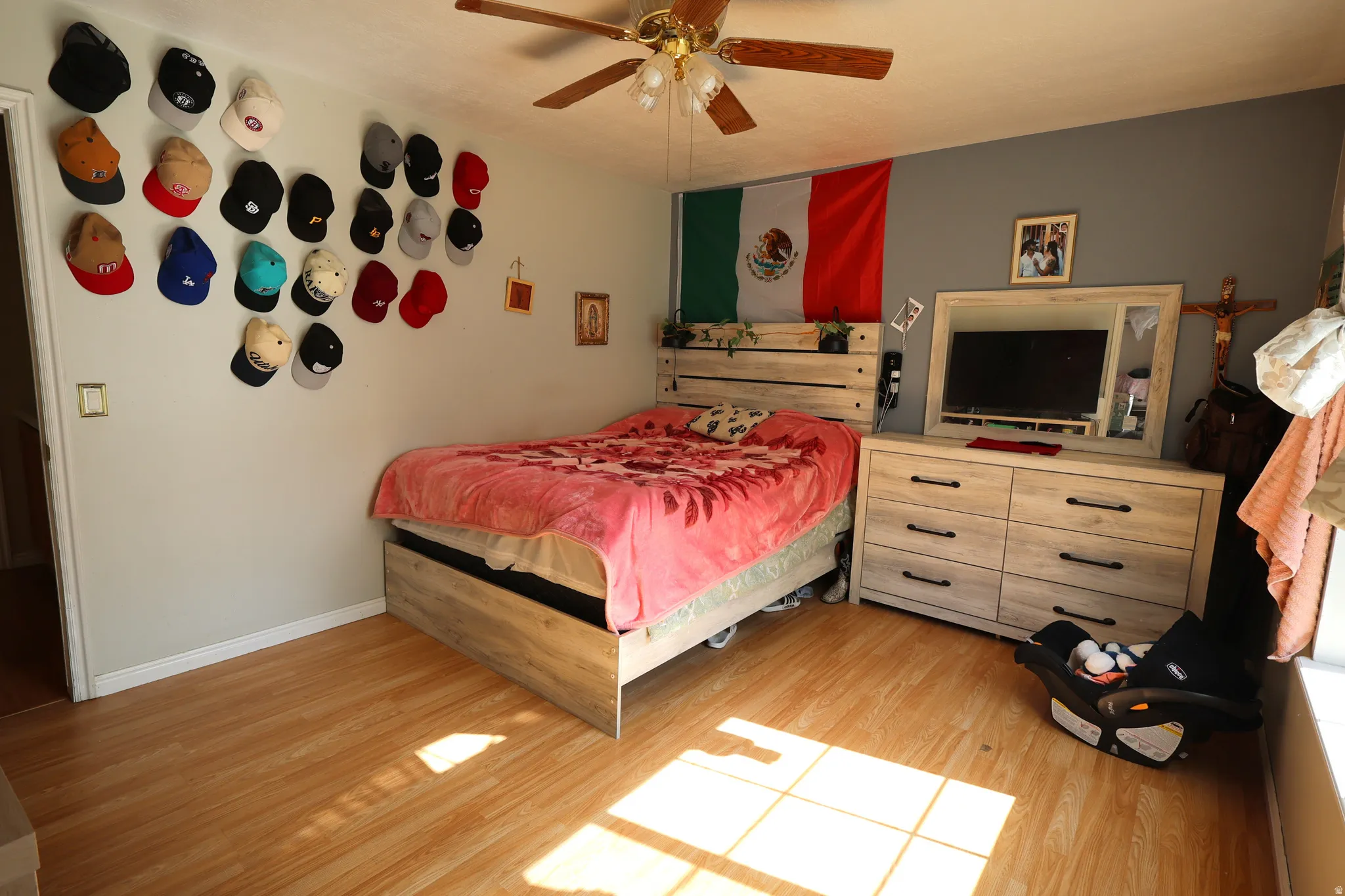 Bedroom featuring light wood finished floors and a ceiling fan
