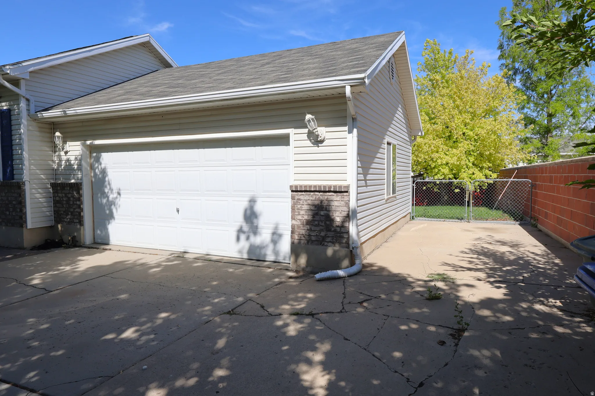 Garage featuring concrete driveway