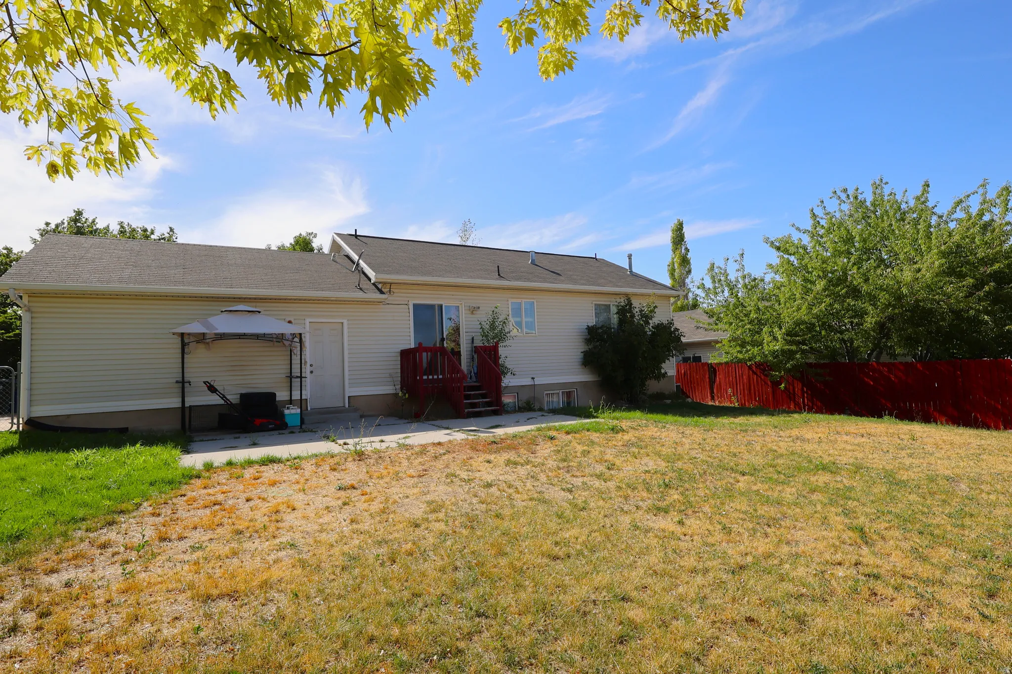 Rear view of house featuring a patio