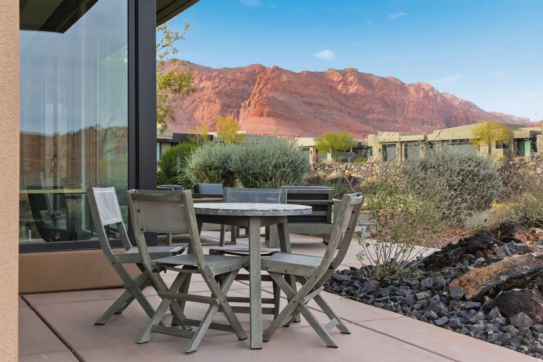 View of patio with outdoor dining space and a mountain view