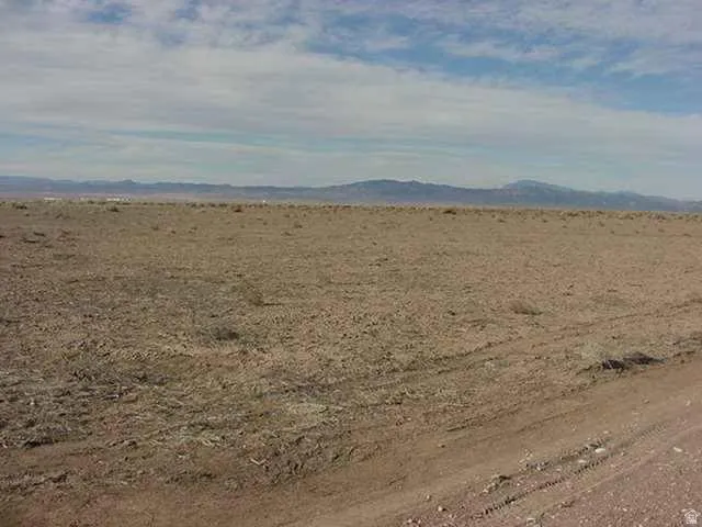 View of mountain backdrop featuring rural landscape