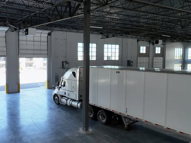 Garage featuring a heating unit