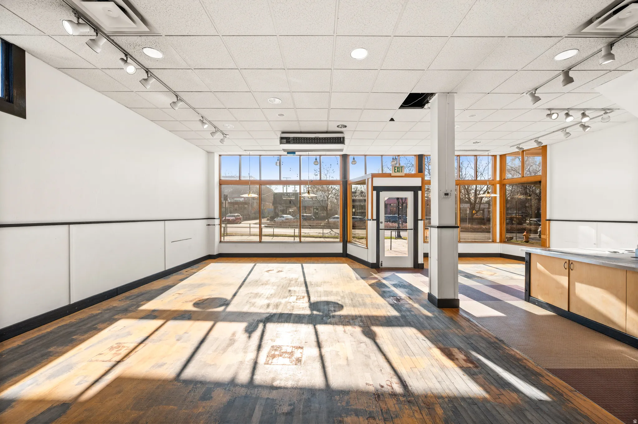 Lobby with a wall of windows and a paneled ceiling