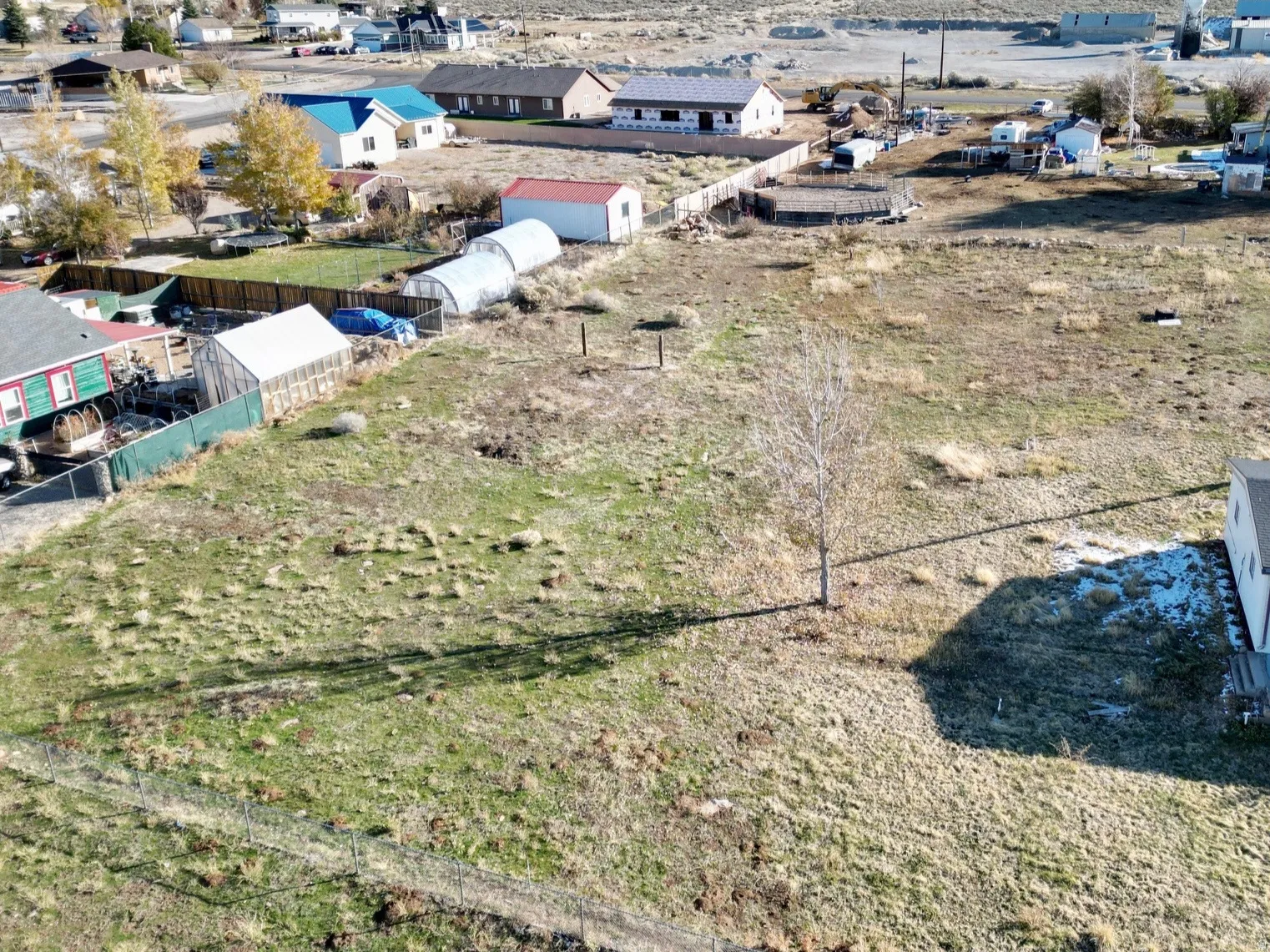 Aerial perspective of suburban area with a mountain backdrop