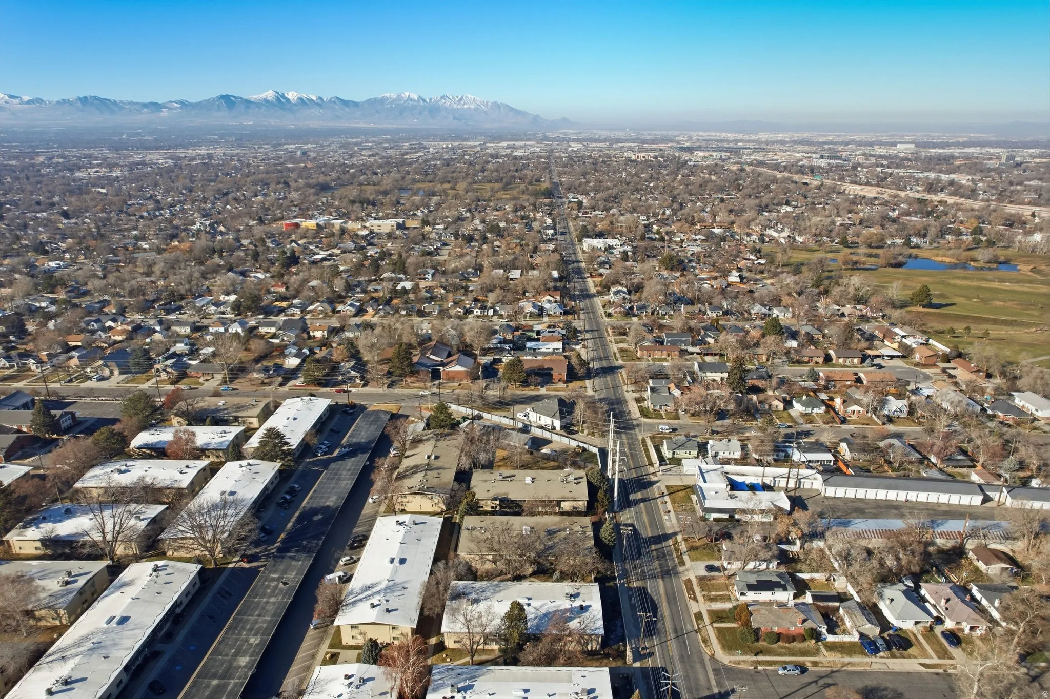 View of property location with nearby suburban area and mountains