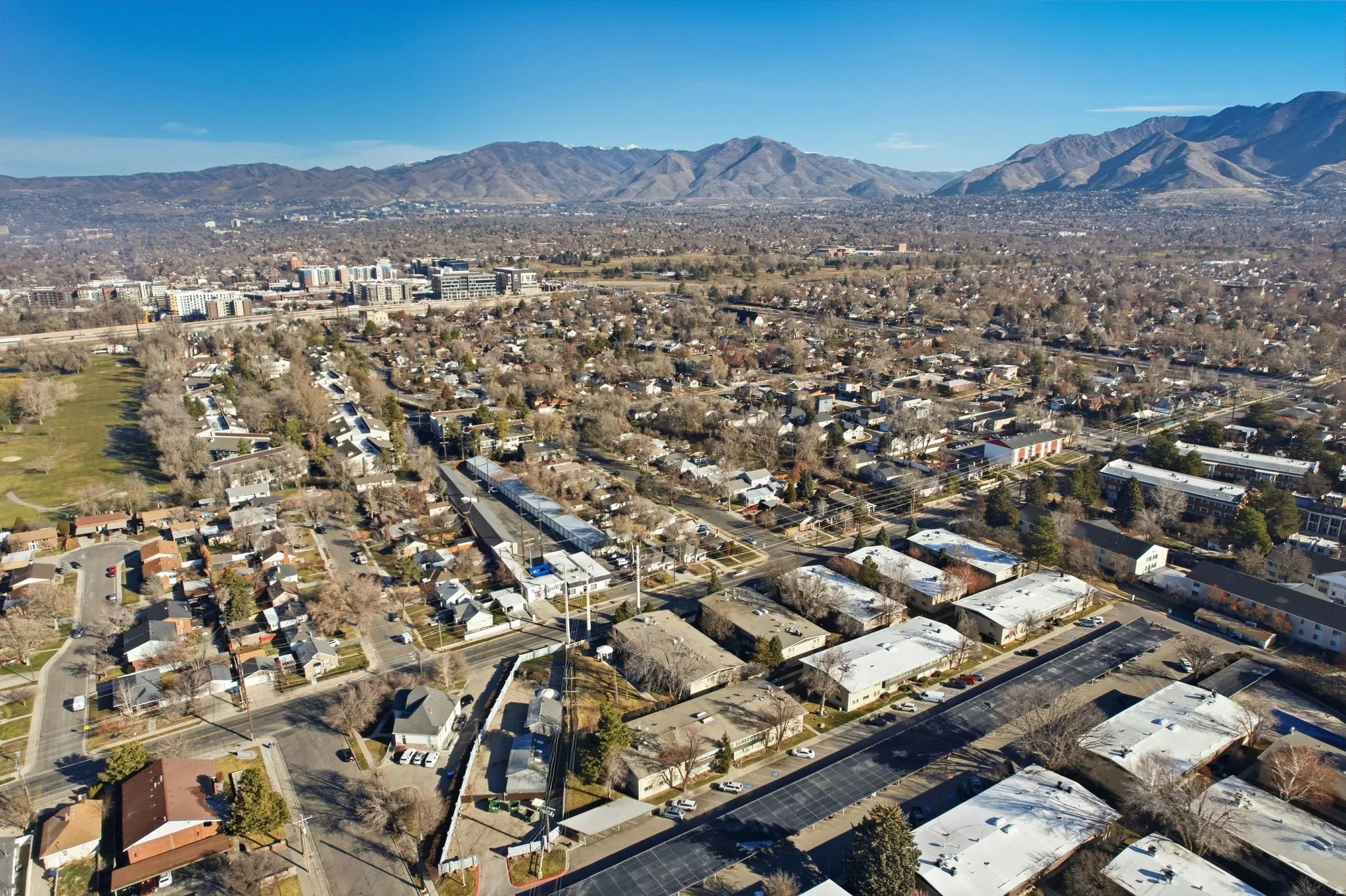 Aerial overview of property's location with a mountainous background