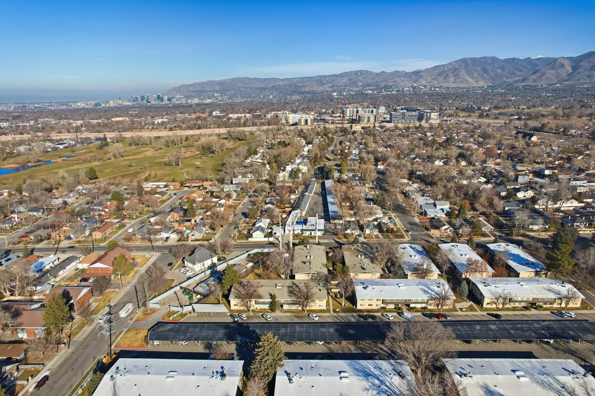 Aerial view of property's location featuring nearby suburban area