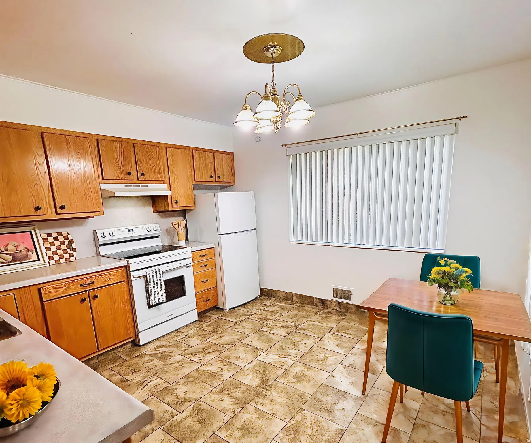 Virtual staging suggestion. Kitchen featuring tile flooring, wood cabinetry, white appliances, and a dining area with a window